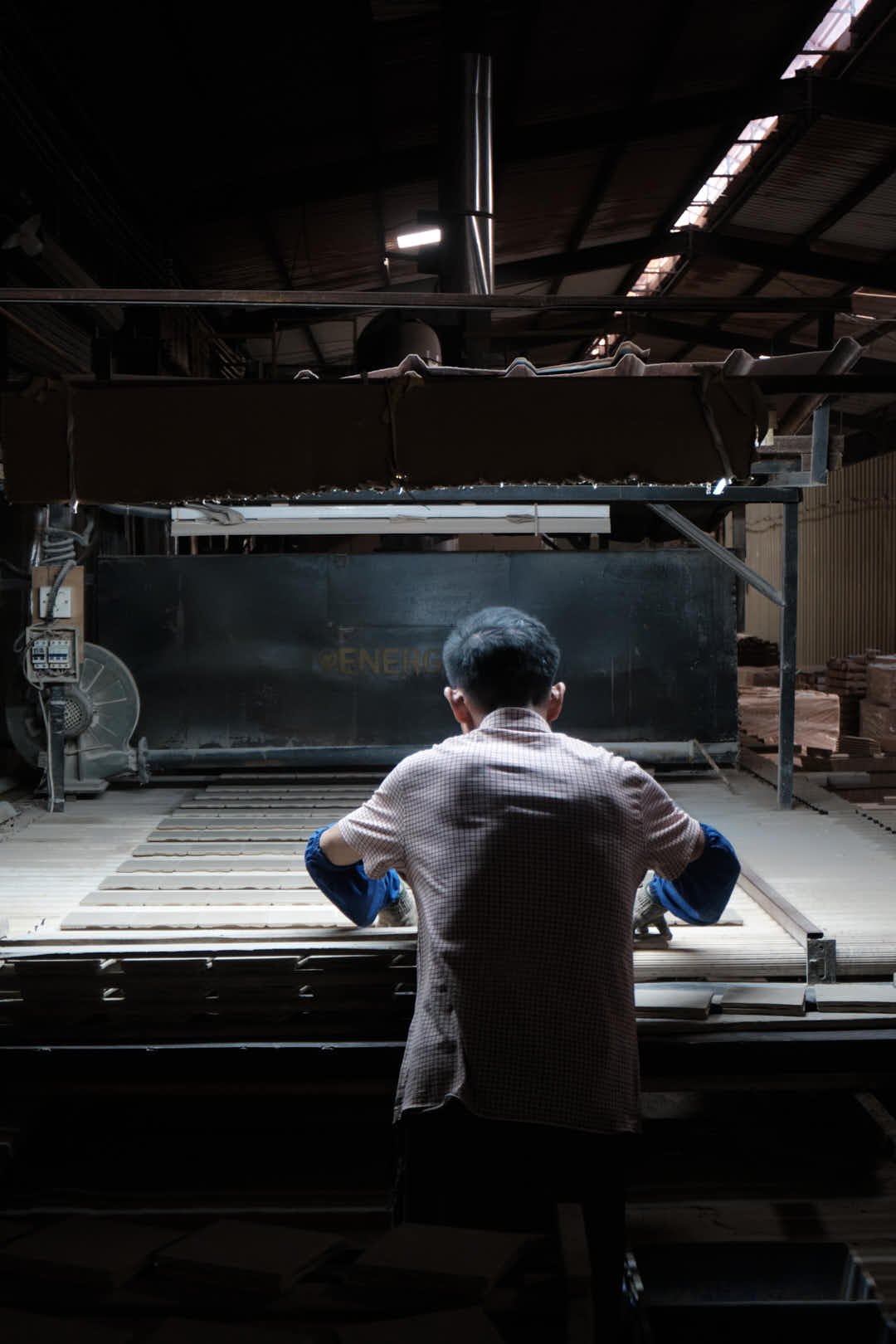 Staff putting tile into the Factory kiln